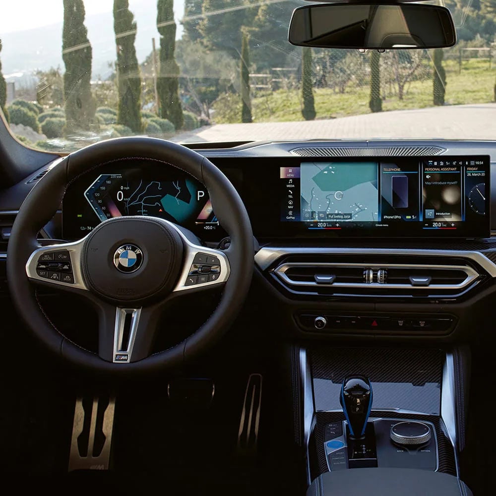 A driver's eye view of steering wheel and controls of the BMW i4 | Taylor BMW in Evans GA
