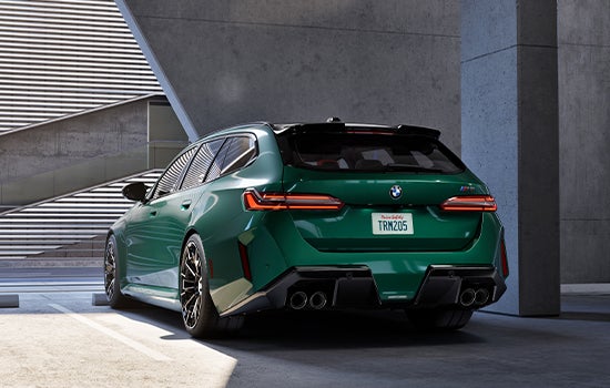 Green BMW M5 Touring parked in garage. | Taylor BMW in Evans GA