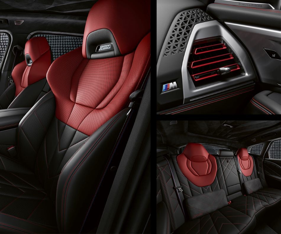 Detail of front seats, clad in exclusive BMW Individual Fiona Red & Black Merino Leather with exclusive M Signature Trim and red stitching and accents. Detail of red accented vent. Detail of rear M Lounge with exclusive XM pillows in Taylor BMW | Evans GA