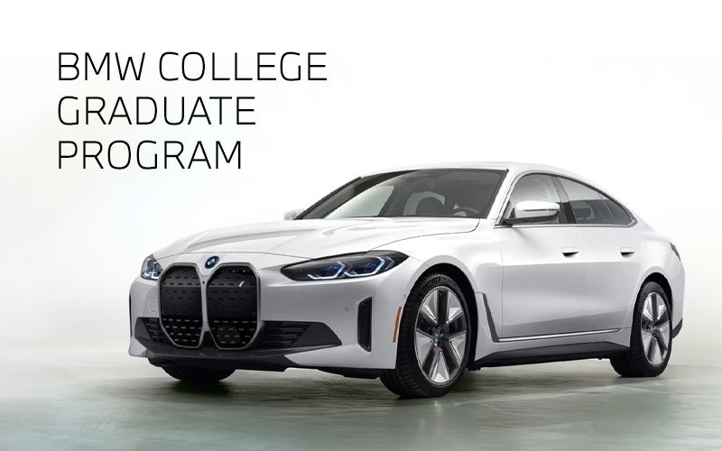 White BMW i4 parked. BMW College Graduate Program. | Taylor BMW in Evans GA